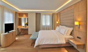 a hotel room with a bed and a television at Ada Suites Nisantasi in Istanbul