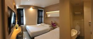Postel nebo postele na pokoji v ubytování Robertson Quay Hotel