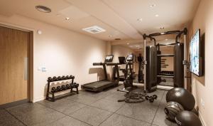 a room with a gym with weights and a television at Straits Place in Edinburgh in Edinburgh