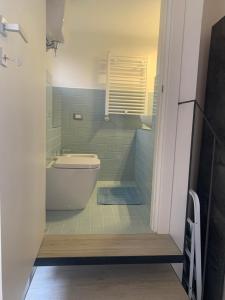 a bathroom with a tub and a toilet and a sink at Casa Paola in Spello +15 photos
