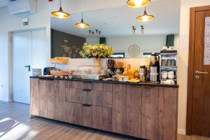 a kitchen with a counter with food on it at Casa Dona Edite Guesthouse Douro in Vilarinho de Cotas