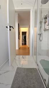 a bathroom with a walk in shower and a glass shower backdoor at Odivelas Home in Odivelas +14 photos