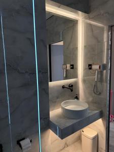 a bathroom with a sink and a mirror at CENTRAL Park in Vinnytsya