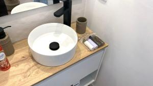 a bathroom with a white sink on a counter at El Patio de María in Ferrol