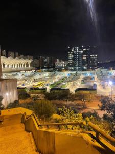 a view of a city at night with buildings at my house in Lisbon