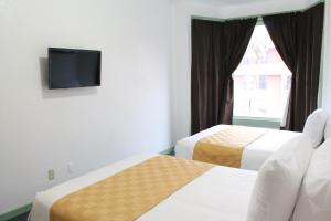 Ένα ή περισσότερα κρεβάτια σε δωμάτιο στο Union Hotel