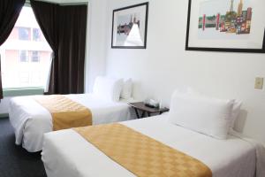 Ένα ή περισσότερα κρεβάτια σε δωμάτιο στο Union Hotel
