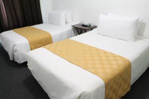 Ένα ή περισσότερα κρεβάτια σε δωμάτιο στο Union Hotel