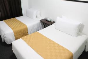 Ένα ή περισσότερα κρεβάτια σε δωμάτιο στο Union Hotel
