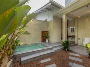 a swimming pool in the middle of a house at The Calm boutique Villa in Ahangama