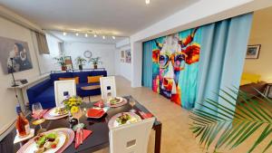 a dining room with a table with plates of food at Fewo Loft Konstanz in Konstanz