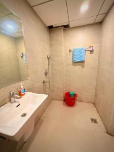 a bathroom with a sink and a shower at ITC Grand Stay in Greater Noida