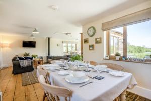 a large dining room with a table and chairs at 3 Bed in Bassaleg oc-bow138 in Bassaleg