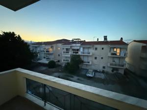 a view from the balcony of a apartment building at Apartment Deniz in Nea Peramos +1 photo