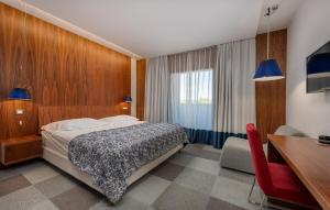 En eller flere senge i et værelse på Hotel IN + 42 billeder