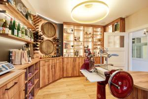 a wine tasting room with a red machine in it at Hotel Zeltinger-Hof - Gasthaus des Rieslings in Zeltingen-Rachtig