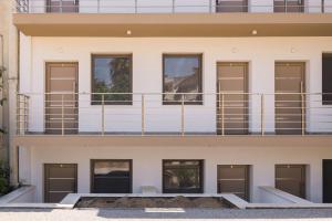 an external view of a building with a balcony at D & D Apartments in Kassandra