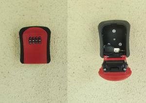 a red and black lightswitch on a wall at B23 Apartman in Harkány