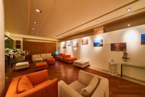 a waiting room with couches and chairs at Grand Hotel Delle Terme Re Ferdinando in Ischia Town