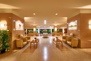 a lobby with couches and tables in a building at Grand Hotel Delle Terme Re Ferdinando in Ischia Town +78 photos