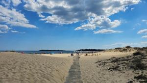 a boardwalk in the sand on a beach at Hotel Longosa - All Inclusive Family Hotel near the beach in the peaceful southern part of Sunny Beach in Sunny Beach +52 photos