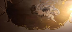 a painting of two cherubs on a wall at Entzückendes Studio in historischer Villa in Aschau +19 photos