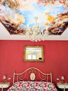 a bedroom with a painting on the ceiling at La Terrazza sul Lago in Capodimonte