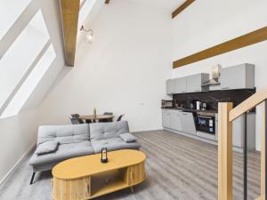 a living room with a couch and a table at Landeskron38 - LK38 in Görlitz