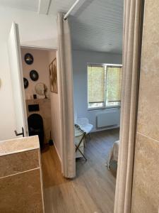 a view of a living room from the hallway at House in forest proche GR and circuit in Saint-Mars-la-Brière +39 photos