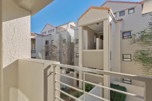 a balcony of a building with white buildings at Spacious Studio Fourways Sandton - Self Check-in in Sandton