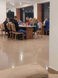 a group of people sitting around a table in a restaurant at Hotel pema raga in Thimphu +36 photos