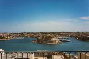a view of a harbor with boats in the water at 66 Saint Paul's & Spa in Valletta +41 photos