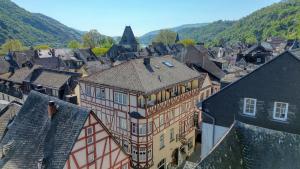 an overhead view of a town with buildings and mountains at Hotel zur Post in Bacharach