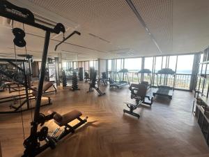 a gym with treadmills and exercise equipment in a building at View Soft House - Quarto e Sala 213 in Lauro de Freitas