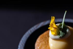 a piece of food with a vegetable on top of it at Karels Restaurant Hotel in Braamt