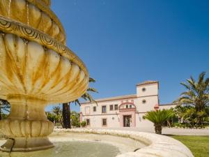 a large fountain in front of a building at Casa Rural El Charruado in Sanlúcar de Barrameda