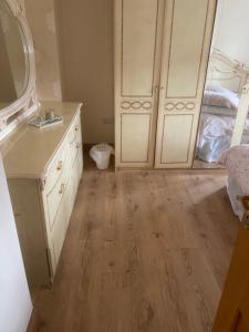 a bathroom with a sink and a mirror and a dresser at Dolly's Homestay in Galway +44 photos