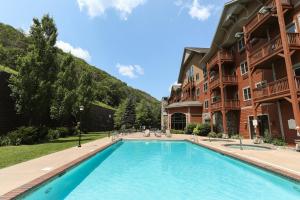a swimming pool in front of a building at Kaatskill Mountain Club & Condos by Vail Resorts in Hunter