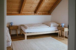 a bedroom with a bed and two night stands at Druhej Domek u ráje in Bystřice
