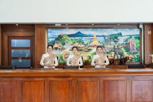 a group of three women standing in a courtroom at Champasak Grand Hotel in Pakse +72 photos