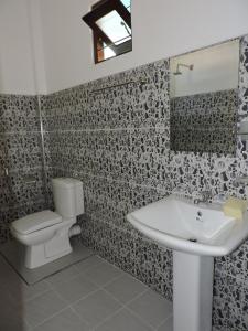 Ett badrum på Seadina Coral Home