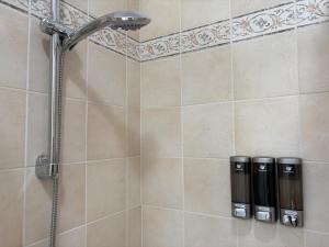 a shower with a shower head in a bathroom at Lake Como - Casa Mafy in Bellano +35 photos
