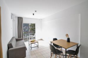 a living room with a couch and a table at Anthea Hotel Apartments in Ayia Napa