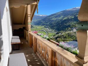a balcony with a view of a valley at Der Waidachhof Zillertal in Hainzenberg