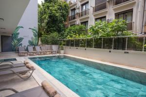 a swimming pool on the side of a building at FIFTY5 Suite Hotel in Marmaris