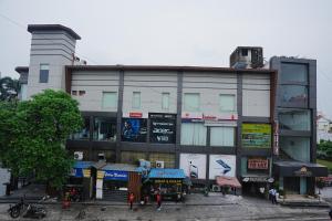 a building with people standing in front of it at Central boutique hotel in Morādābād