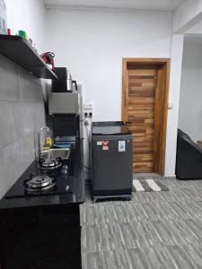 a kitchen with a stove and a counter top at The Palms Property in Long Mountain