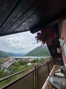 a balcony with a view of a river and mountains at Apartment Mountain Paradise Plav in Plav +31 photos