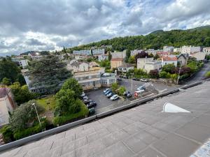 an aerial view of a city with a parking lot at Studio cosy proche des Thermes in Royat