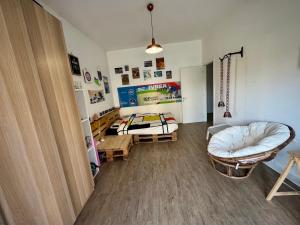 a room with a bedroom with a bed and a table at Dora Flow in Banchette